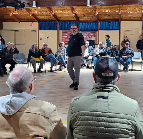 Dameon Wall, external relations manager with Riding Mountain National Park, speaks to a group of around 60 people who showed up to the Onanole Rec Centre on Tuesday night to discuss how the park might deal with zebra mussels in Clear Lake in the future. (Miranda Leybourne/The Brandon Sun)