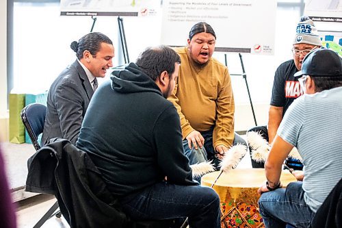 MIKAELA MACKENZIE / WINNIPEG FREE PRESS
	
Premier Wab Kinew joins the Sons of the Drum singers in an opening song at Portage Place on Tuesday, Dec. 12, 2023. For Joyanne story.
Winnipeg Free Press 2023