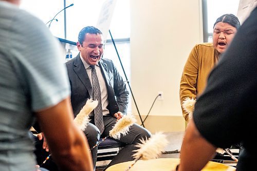 MIKAELA MACKENZIE / WINNIPEG FREE PRESS
	
Premier Wab Kinew joins the Sons of the Drum singers in an opening song at Portage Place on Tuesday, Dec. 12, 2023. For Joyanne story.
Winnipeg Free Press 2023