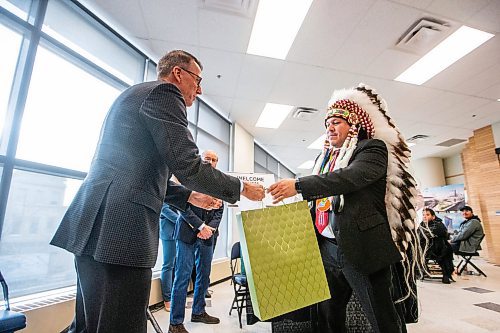 MIKAELA MACKENZIE / WINNIPEG FREE PRESS
	
Mark Chipman, True North executive board chairman (left), and Jerry Daniels, grand chief of the Southern Chiefs&#x560;Organization, exchange gifts after the signing of a memorandum of understanding at Portage Place on Tuesday, Dec. 12, 2023. For Joyanne story.
Winnipeg Free Press 2023