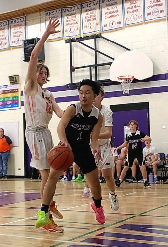 Vincent Massey Vikings guard Christian Santin a shot against the Yorkton Raiders during their opening game of the BSSI at Massey on Thursday. (Thomas Friesen/The Brandon Sun)