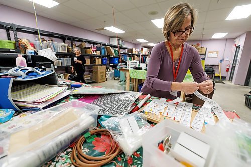 MIKE DEAL / WINNIPEG FREE PRESS
Marlene Penner, 59, volunteers at the Kildonan MCC Thrift Shop, where she sorts and prices craft-related donations.
See Aaron App story
231214 - Thursday, December 14, 2023.