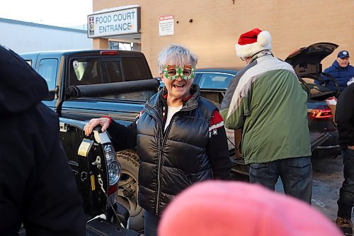 14122023
Jill Lee sports festive glasses while Christmas Hampers are loaded into her vehicle for delivery at the Brandon &amp; Westman Christmas Cheer Registry on Thursday. Lee and other volunteers fanned out across Brandon and Westman on Wednesday and Thursday to deliver hampers.
(Tim Smith/The Brandon Sun)