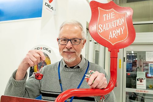 BROOK JONES / WINNIPEG FREE PRESS
John Longhurst, who has been the Winnipeg Free Press faith columnist/reporter since 2003, holds Christmas bells and candy canes as he volunteers for the Salvation Army's Christmas Kettle campaign by helping to collecting donations at the Superstore at Gateway Road and McLeod Avenue in Winnipeg, Man., Thursday, Dec. 14, 2023. The Salvation Army's Christmas Kettle campaign is one of Canada's largest and most recognizable annual charitable events with 2,000 locations across Canada.