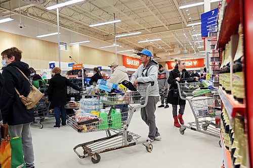 Local grocery stores were full of frantic customers Tuesday afternoon, looking to purchase last-minute items likely in preparation for the snowstorm that is expected to cover Brandon in 25 to 40 centimetres of snow over the next few days. At the Real Canadian Superstore (pictured here), checkout lines stretched across the building. Customers could be seen buying bottled water and other essential items. (The Brandon Sun)