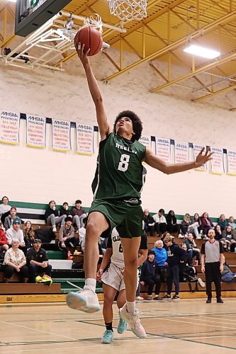 Kwali Taylor of the Neelin Spartans goes up for a layup against the Dauphin Clippers during Brandon Sun Spartan Invitational basketball action at Neelin on Friday. (Tim Smith/The Brandon Sun)