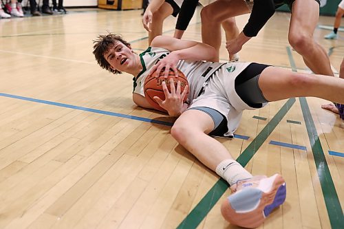 Nick Hudyma of the Dauphin Clippers hits the ground for a loose ball. (Tim Smith/The Brandon Sun)