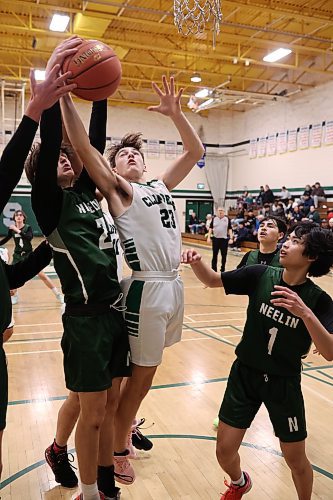 16122023
Junior Martine #2 of the Neelin Spartans and Ronin Mouck #23 of the Dauphin Clippers grapple for the loose ball during their 20th annual Brandon Sun Spartan Invitational game at &#xc9;cole Secondaire Neelin High School on Friday.
(Tim Smith/The Brandon Sun)