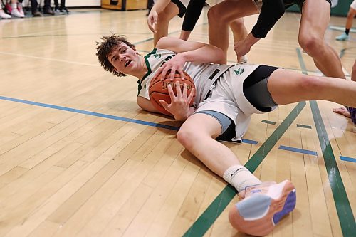 16122023
Nick Hudyma #2 of the Dauphin Clippers tries to hold onto the ball after tripping during the Clippers 20th annual Brandon Sun Spartan Invitational game against the Neelin Spartans at &#xc9;cole Secondaire Neelin High School on Friday.
(Tim Smith/The Brandon Sun)