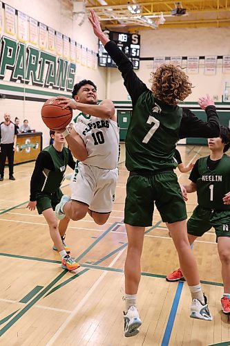 16122023
Stephen Dayawon of the Dauphin Clippers leaps to take a shot on the net during their 20th annual Brandon Sun Spartan Invitational game against the Neelin Spartans at &#xc9;cole Secondaire Neelin High School on Friday.
(Tim Smith/The Brandon Sun)