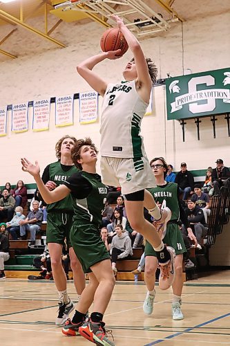 16122023
Nick Hudyma #2 of the Dauphin Clippers leaps to let a shot off on net during the Clippers 20th annual Brandon Sun Spartan Invitational game against the Neelin Spartans at &#xc9;cole Secondaire Neelin High School on Friday.
(Tim Smith/The Brandon Sun)
