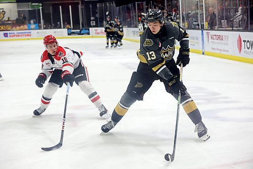 16122023
Roger McQueen #13 of the Brandon Wheat Kings tries to keep the puck ahead of Connor Schmidt #10 of the Moose Jaw Warriors during WHL action at Westoba Place on Saturday evening.
(Tim Smith/The Brandon Sun)