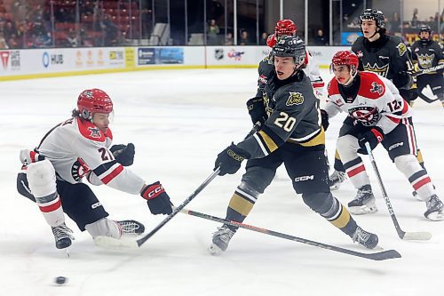 16122023
Hayden Wheddon #20 of the Brandon Wheat Kings fires a shot on net as Aiden Ziprick #21 of the Moose Jaw Warriors tries to block the shot during WHL action at Westoba Place on Saturday evening.
(Tim Smith/The Brandon Sun)