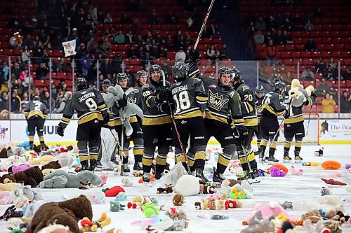 16122023
Brandon Wheat Kings players celebrate their first goal against the Moose Jaw Warriors as stuffed toys rain down onto the ice during Teddy Bear Toss night at Westoba Place on Saturday evening. The collected stuffed animals go to the Brandon-Westman Christmas Cheer Registry and the Westman Traditional Christmas Dinner. Fans also donated warm clothing, gifts and non-perishable goods. (Tim Smith/The Brandon Sun)