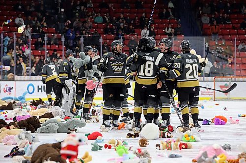 16122023
Brandon Wheat Kings players celebrate their first goal against the Moose Jaw Warriors as stuffed toys rain down onto the ice during Teddy Bear Toss night at Westoba Place on Saturday evening. The collected stuffed animals go to the Brandon-Westman Christmas Cheer Registry and the Westman Traditional Christmas Dinner. Fans also donated warm clothing, gifts and non-perishable goods. (Tim Smith/The Brandon Sun)