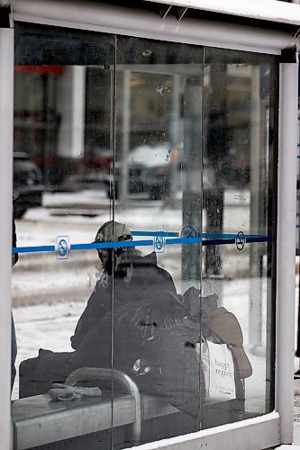 JOHN WOODS / WINNIPEG FREE PRESS
Jolly Cabigting sits in a bus shelter on Graham Avenue in Winnipeg Sunday, December 17, 2023. 

Reporter: gabby