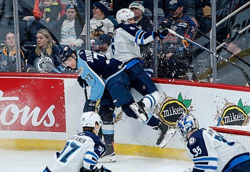 JOHN WOODS / WINNIPEG FREE PRESS
Manitoba Moose Ashton Sautner (6) and Milwaukee Admirals’ Mark Jankowski (77) collide during second period AHL action in Winnipeg on Sunday, December 17, 2023.

Reporter: ?