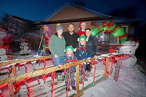 18122023
Jeff and Tara Carey (back centre and back right respectively) and their four children Morgan (L) Kinslee (front left) Chase (front right) and Emerson (santa hat) outside their brightly decorated home along the 2700 block of Princess Avenue on Monday evening.
(Tim Smith/The Brandon Sun)