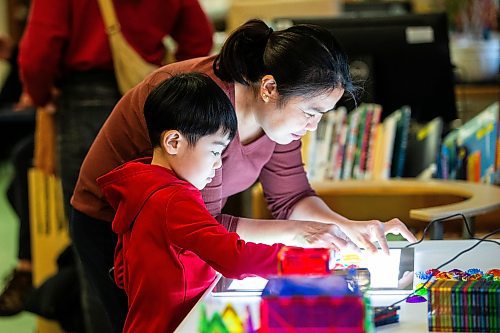 MIKAELA MACKENZIE / WINNIPEG FREE PRESS
	
Marites Lacson and her son, Jared Lacson (seven), take part in the Young Designer Program at Weston School on Wednesday, Dec. 13, 2023. For Maggie story.
Winnipeg Free Press 2023