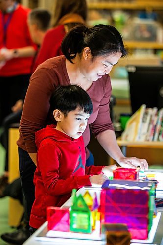 MIKAELA MACKENZIE / WINNIPEG FREE PRESS
	
Marites Lacson and her son, Jared Lacson (seven), take part in the Young Designer Program at Weston School on Wednesday, Dec. 13, 2023. For Maggie story.
Winnipeg Free Press 2023