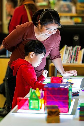 MIKAELA MACKENZIE / WINNIPEG FREE PRESS
	
Marites Lacson and her son, Jared Lacson (seven), take part in the Young Designer Program at Weston School on Wednesday, Dec. 13, 2023. For Maggie story.
Winnipeg Free Press 2023