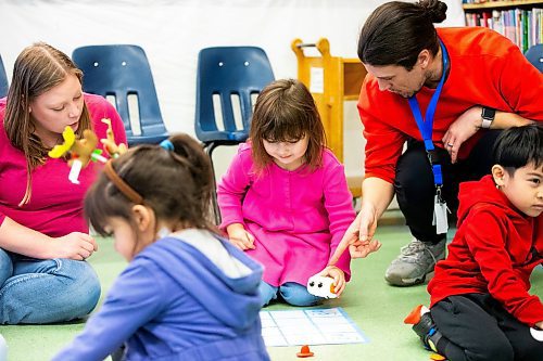 MIKAELA MACKENZIE / WINNIPEG FREE PRESS
	
Program lead Adam Charbonneau helps Geneveive Lavallee (four) with a robot at the Young Designer Program at Weston School on Wednesday, Dec. 13, 2023. For Maggie story.
Winnipeg Free Press 2023