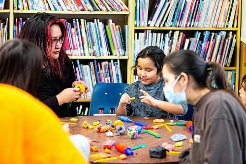 MIKAELA MACKENZIE / WINNIPEG FREE PRESS
	
Lorraine Munrow and her son, Dennis Linklater (six), create with plasticine at the Young Designer Program at Weston School on Wednesday, Dec. 13, 2023. For Maggie story.
Winnipeg Free Press 2023