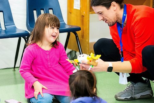 MIKAELA MACKENZIE / WINNIPEG FREE PRESS
	
Program lead Adam Charbonneau helps Geneveive Lavallee (four) with a robot at the Young Designer Program at Weston School on Wednesday, Dec. 13, 2023. For Maggie story.
Winnipeg Free Press 2023