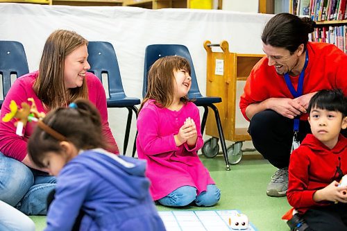 MIKAELA MACKENZIE / WINNIPEG FREE PRESS
	
Geneveive Lavallee (four) grins after a successful robot run as her mom, Madison Harcus (left), and program lead Adam Charbonneau help at the Young Designer Program at Weston School on Wednesday, Dec. 13, 2023. For Maggie story.
Winnipeg Free Press 2023