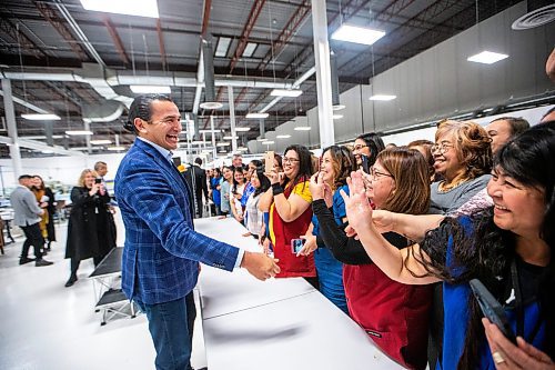 MIKAELA MACKENZIE / WINNIPEG FREE PRESS
	
Wab Kinew greets excited employees during a tour of the Canada Goose factory on Friday, Dec. 15, 2023. For Maggie story.
Winnipeg Free Press 2023