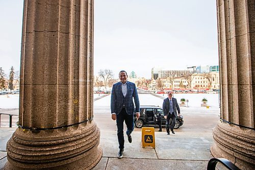 MIKAELA MACKENZIE / WINNIPEG FREE PRESS
	
Wab Kinew walks back up the legislative building steps on Friday, Dec. 15, 2023. For Maggie story.
Winnipeg Free Press 2023