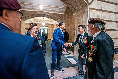 MIKAELA MACKENZIE / WINNIPEG FREE PRESS
	
Wab Kinew greets Portuguese war veterans at the legislative building on Friday, Dec. 15, 2023. For Maggie story.
Winnipeg Free Press 2023