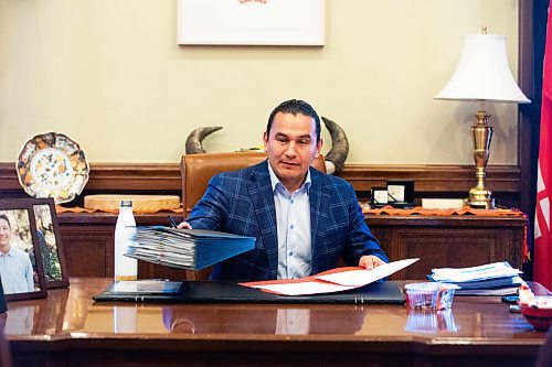 MIKAELA MACKENZIE / WINNIPEG FREE PRESS
	
Wab Kinew looks through urgent papers and a correspondence folder in his office on Friday, Dec. 15, 2023. For Maggie story.
Winnipeg Free Press 2023