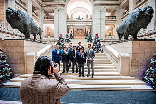 MIKAELA MACKENZIE / WINNIPEG FREE PRESS
	
Wab Kinew takes a photo with Portuguese war veterans at the legislative building on Friday, Dec. 15, 2023. For Maggie story.
Winnipeg Free Press 2023