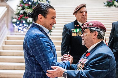 MIKAELA MACKENZIE / WINNIPEG FREE PRESS
	
Wab Kinew greets Portuguese war veteran Pedro Correia at the legislative building on Friday, Dec. 15, 2023. For Maggie story.
Winnipeg Free Press 2023