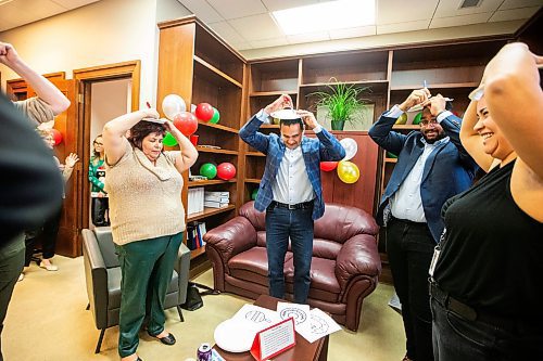 MIKAELA MACKENZIE / WINNIPEG FREE PRESS
	
Wab Kinew takes part in games during a holiday party for the Indigenous reconciliation office on Friday, Dec. 15, 2023. For Maggie story.
Winnipeg Free Press 2023