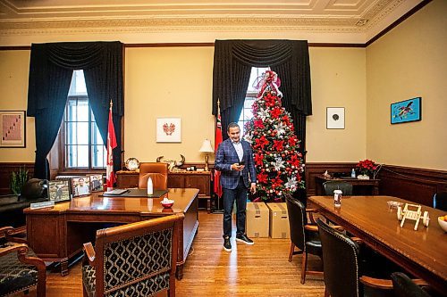 MIKAELA MACKENZIE / WINNIPEG FREE PRESS
	
Wab Kinew takes a moment to text with his son (who was having problems finding his basketball shoes) in his office on Friday, Dec. 15, 2023. For Maggie story.
Winnipeg Free Press 2023