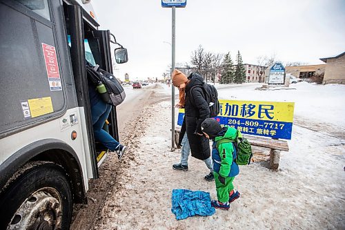MIKAELA MACKENZIE / WINNIPEG FREE PRESS
	
Venera Sorkina and her son, Ivan, board the first bus back home from Mosaic's English language class on Monday, Dec. 11, 2023. For Malak story.
Winnipeg Free Press 2023