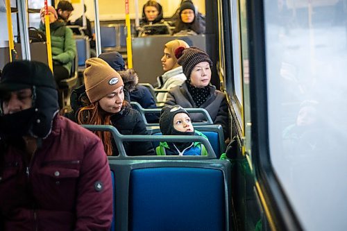 MIKAELA MACKENZIE / WINNIPEG FREE PRESS
	
Venera Sorkina and her son, Ivan, take the second bus on their way back home from Mosaic's English language class on Monday, Dec. 11, 2023. For Malak story.
Winnipeg Free Press 2023