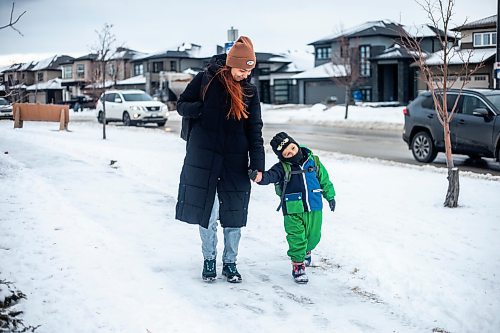 MIKAELA MACKENZIE / WINNIPEG FREE PRESS
	
Venera Sorkina and her son, Ivan, walk after taking the bus back home from Mosaic's English language class on Monday, Dec. 11, 2023. For Malak story.
Winnipeg Free Press 2023