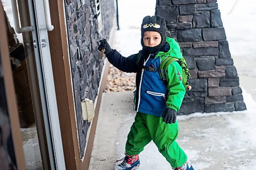 MIKAELA MACKENZIE / WINNIPEG FREE PRESS
	
Ivan Sorkina unlocks the apartment building&#x573; door after taking the bus back home from daycare and his mom&#x573; Mosaic's English language class on Monday, Dec. 11, 2023. For Malak story.
Winnipeg Free Press 2023