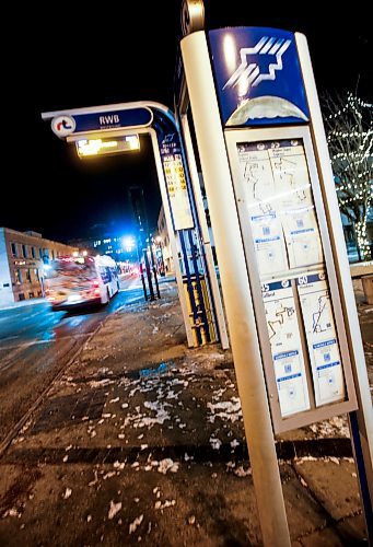 JOHN WOODS / WINNIPEG FREE PRESS
A bus and signage on Graham Avenue in Winnipeg Monday, December  18, 2023. 

Reporter: ?