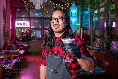 BROOK JONES / WINNIPEG FREE PRESS
Conrado Penales showing off a zero-proof coconut bliss he made at Bahay Kubo at 48 Albert St., in Winnipeg, Man., Friday, Dec. 15, 2023.