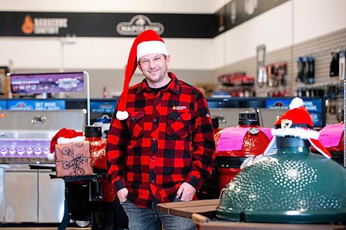 MIKAELA MACKENZIE / WINNIPEG FREE PRESS
	
Evan Fogg, co-owner of Luxe BBQ Company, at the Kenaston store location on Tuesday, Dec. 19, 2023. The unseasonally warm weather has meant more business for the grilling shop. For Malak story.
Winnipeg Free Press 2023