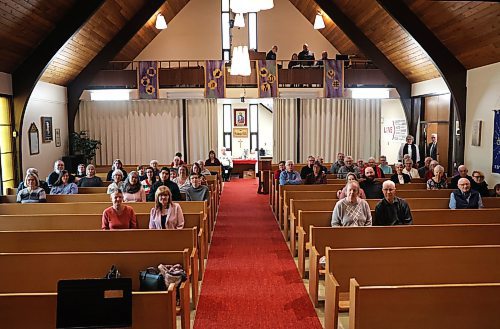 The combined congregations of St. George's Anglican Church and Redeemer Lutheran Church attend services on Dec. 17. After combining forces in September, the churches now share a building and a priest. (Kyla Henderson/The Brandon Sun)