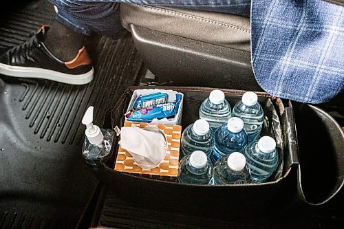 MIKAELA MACKENZIE / WINNIPEG FREE PRESS
	
On-the-road essentials, including hand sanitizer and protien bars, in the RCMP car for Wab Kinew on Friday, Dec. 15, 2023. For Maggie story.
Winnipeg Free Press 2023