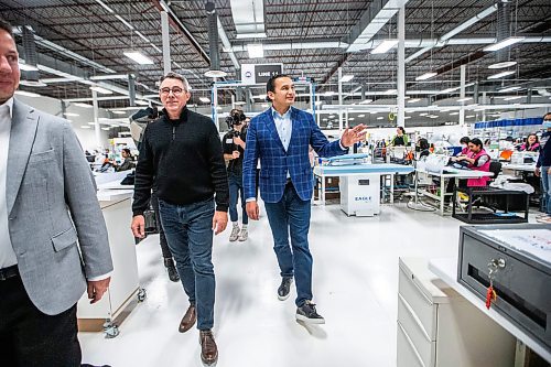 MIKAELA MACKENZIE / WINNIPEG FREE PRESS
	
Wab Kinew takes a tour of the Canada Goose factory with COO John Moran on Friday, Dec. 15, 2023. For Maggie story.
Winnipeg Free Press 2023