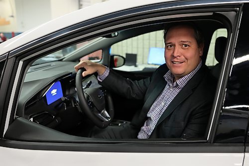 Murray Chevrolet Cadillac Buick GMC Brandon dealer principal Rich Pentney in a 2023 Chevrolet Bolt EV LT. Pentney says Brandon is in critical need of improved infrastructure, saying the challenge of insufficient charging stations is a significant barrier to widespread EV adoption. Photo: Abiola Odutola/The Brandon Sun