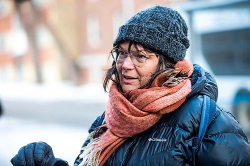 MIKAELA MACKENZIE / WINNIPEG FREE PRESS
	
Nathalie Kleinschmidt, who lives on the street and regularly walks her dog past the building, at 24 Carlton Street on Wednesday, Dec. 20, 2023. For Erik story.
Winnipeg Free Press 2023