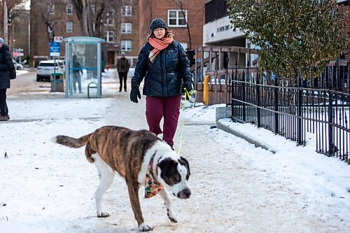 MIKAELA MACKENZIE / WINNIPEG FREE PRESS
	
Nathalie Kleinschmidt, who lives on the street and regularly walks her dog past the building, at 24 Carlton Street on Wednesday, Dec. 20, 2023. For Erik story.
Winnipeg Free Press 2023